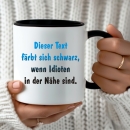 Sprüchetasse: Lena - Dieser Text färbt sich schwarz, wenn Idioten in der Nähe sind.